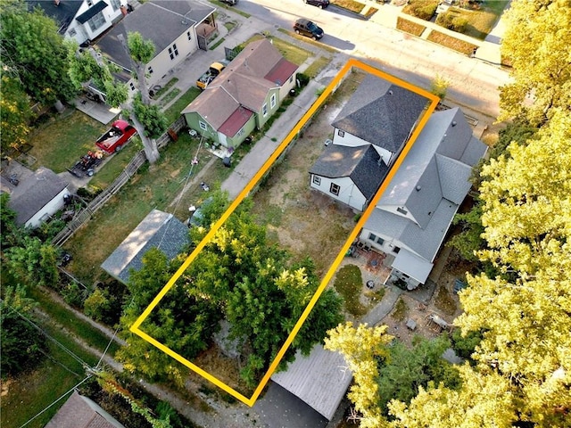 birds eye view of property with a residential view