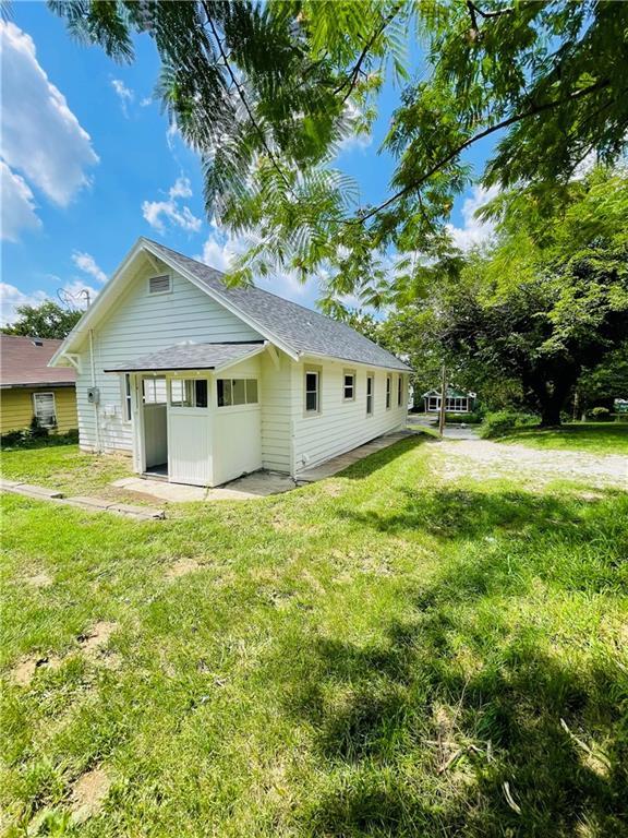 back of house with a yard