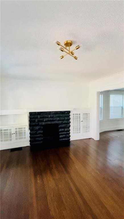 unfurnished living room with dark hardwood / wood-style floors