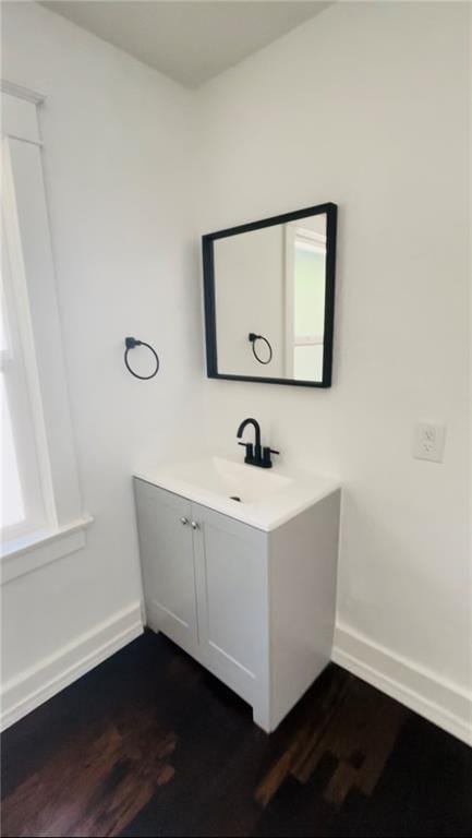 bathroom with vanity and hardwood / wood-style floors