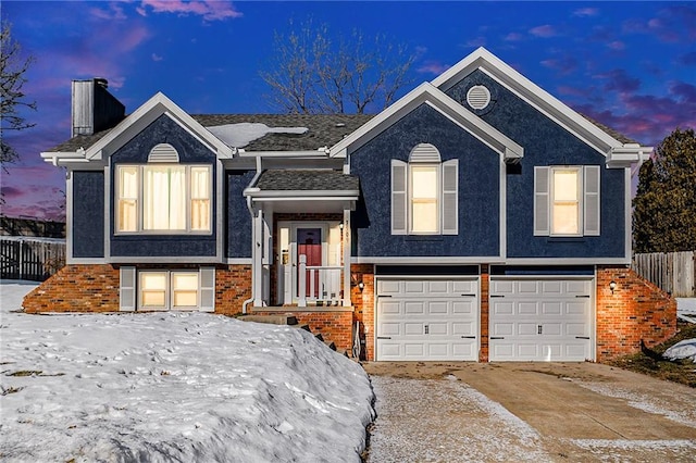 bi-level home featuring a garage