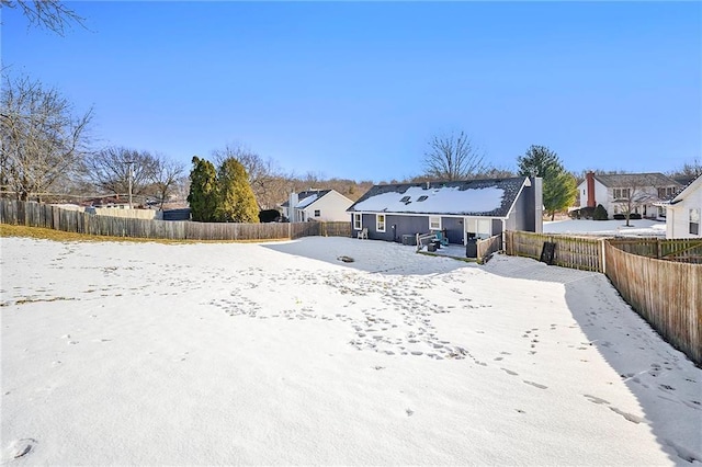 view of snow covered house