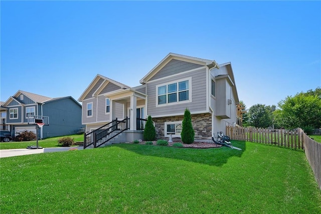 view of front facade with a garage and a front yard