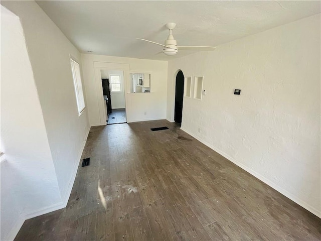 empty room featuring dark hardwood / wood-style floors and ceiling fan