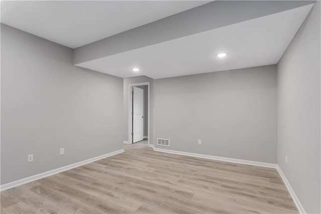 unfurnished room with light wood-type flooring