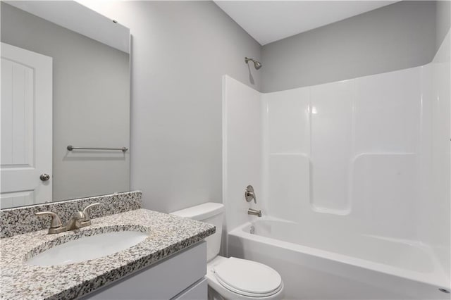 full bathroom with vanity, bathtub / shower combination, and toilet