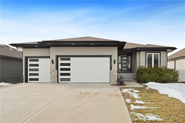 prairie-style house featuring a garage