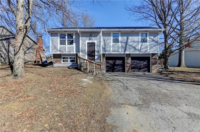 raised ranch featuring a garage