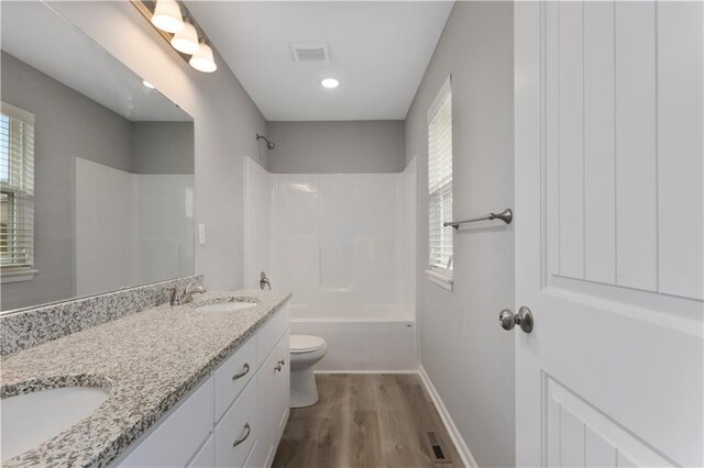 702 Winter Dr, Belton, MO 64012 - full bath with plenty of natural light, visible vents, and a sink