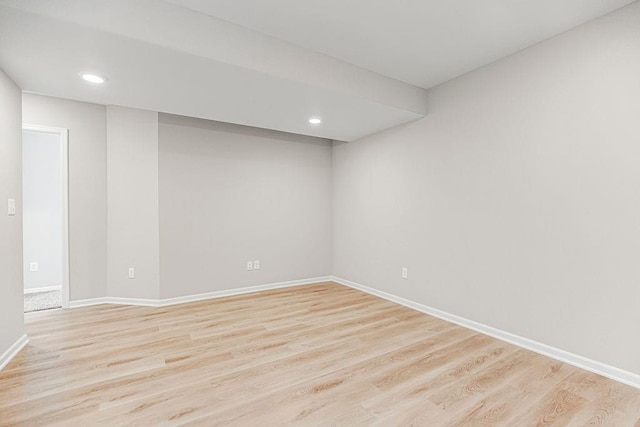 702 Winter Dr, Belton, MO 64012 - empty room with light wood finished floors, recessed lighting, and baseboards