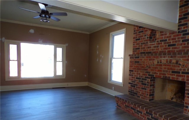 unfurnished living room with ceiling fan, ornamental molding, dark hardwood / wood-style floors, and a brick fireplace