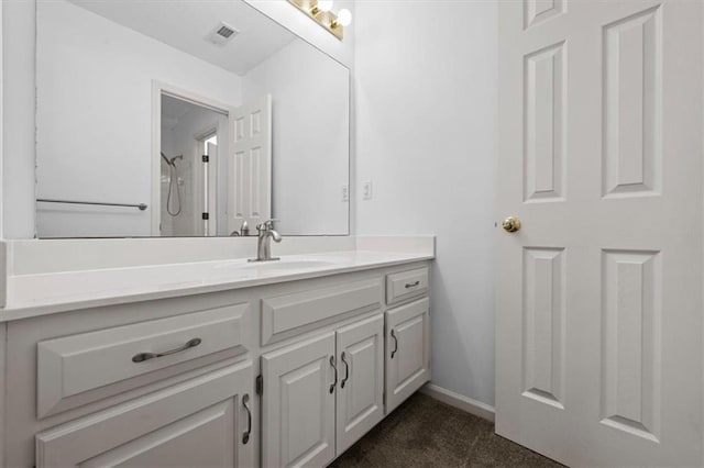 bathroom featuring vanity and walk in shower