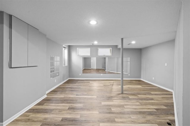 basement featuring light wood-type flooring