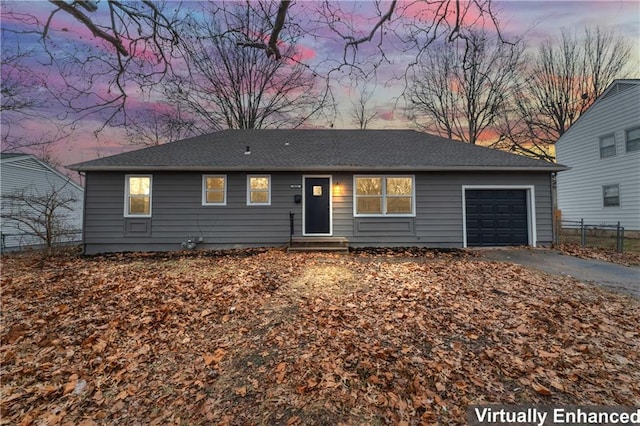 single story home with a garage