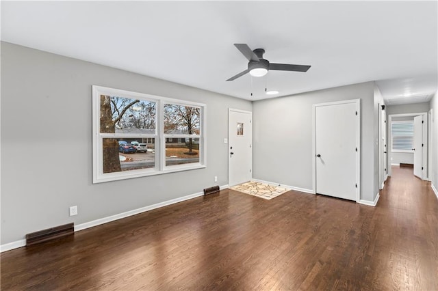 interior space featuring dark hardwood / wood-style floors and ceiling fan