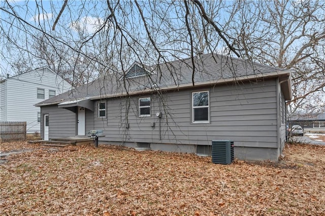 rear view of house with cooling unit