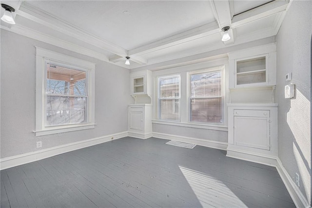 spare room with beamed ceiling, coffered ceiling, dark hardwood / wood-style floors, and crown molding