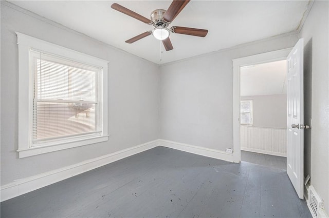 spare room with dark hardwood / wood-style flooring and ceiling fan