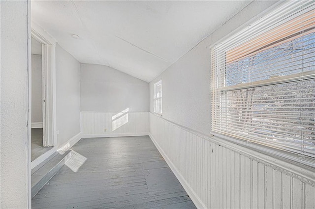 2463 Denver Ave, Kansas City, MO 64127 - hall featuring hardwood / wood-style flooring, vaulted ceiling, and wainscoting