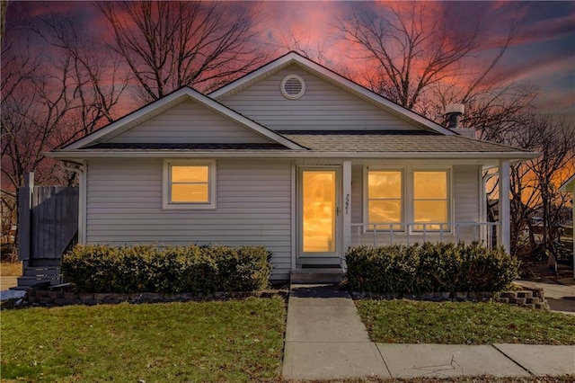 bungalow-style home featuring a yard