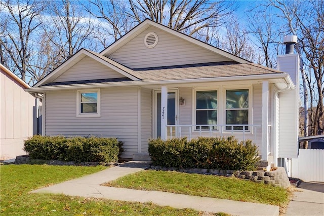 bungalow-style home with a front lawn