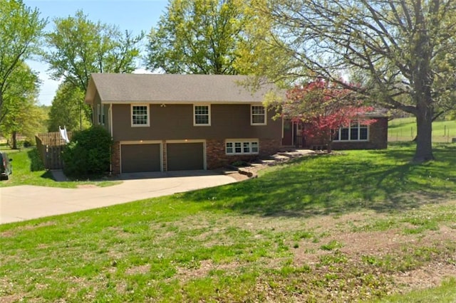 view of front facade with a garage and a front yard