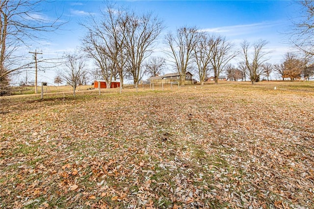 view of yard with a rural view