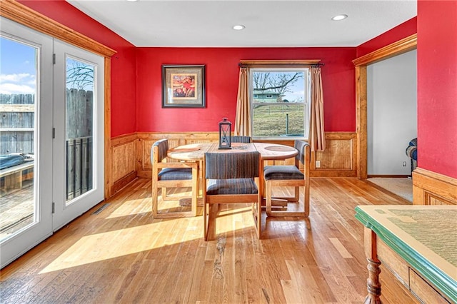 dining space with light hardwood / wood-style flooring