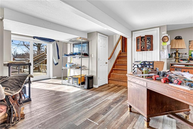 kitchen featuring hardwood / wood-style flooring and a textured ceiling