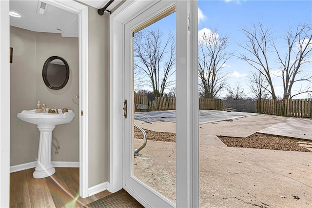 entryway with hardwood / wood-style flooring