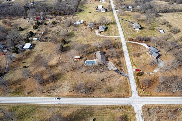 birds eye view of property with a rural view