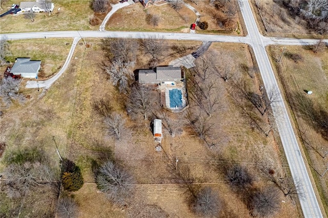 birds eye view of property featuring a rural view