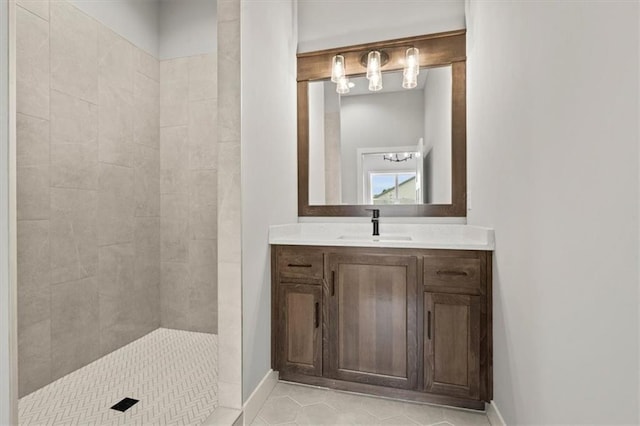 bathroom featuring a shower, tile patterned floors, and vanity