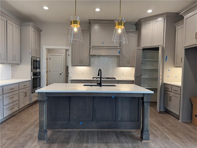 kitchen with light countertops, appliances with stainless steel finishes, and gray cabinetry