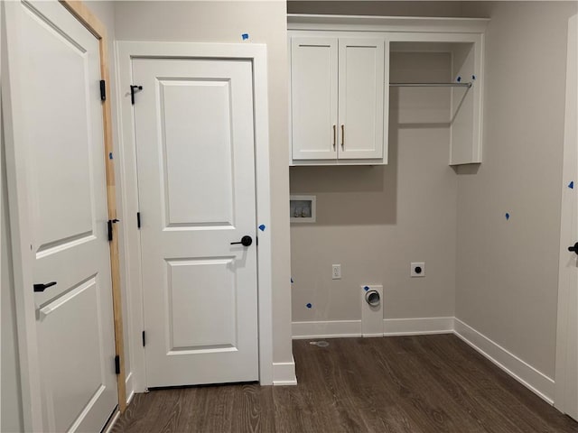 washroom with dark wood-style floors, washer hookup, hookup for an electric dryer, and cabinet space