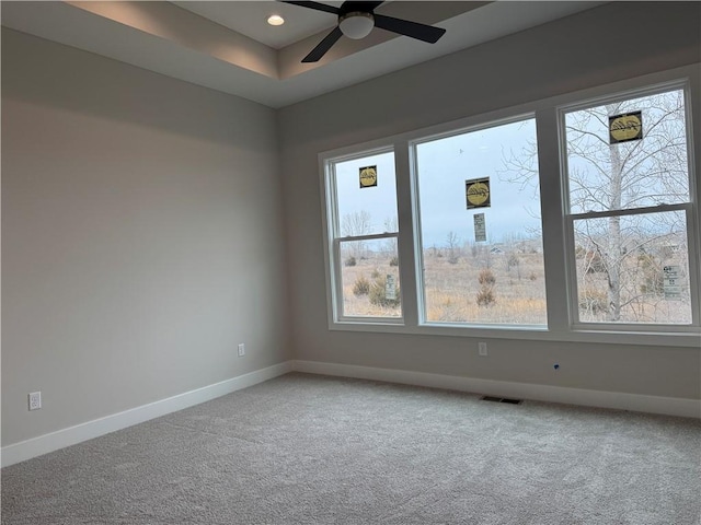 carpeted empty room featuring visible vents, baseboards, a ceiling fan, and recessed lighting