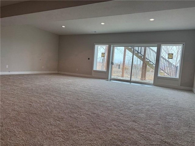 carpeted spare room featuring baseboards and recessed lighting