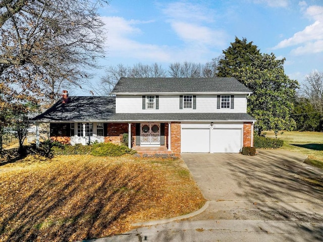 view of front property featuring a garage and covered porch