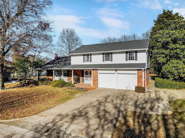 view of front facade with a garage and a porch