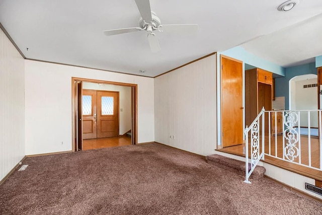 unfurnished room with ceiling fan, ornamental molding, and carpet