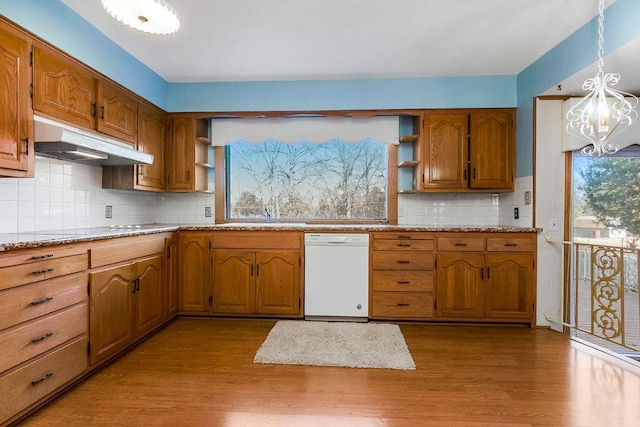 kitchen with decorative light fixtures, a chandelier, dishwasher, and light wood-type flooring