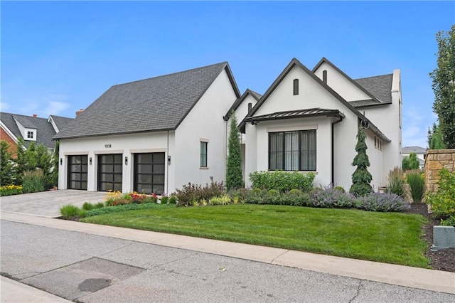 9358 Juniper Reserve Dr, Prairie Village, KS 66207 - view of front of house with stucco siding, a standing seam roof, a garage, a front yard, and driveway