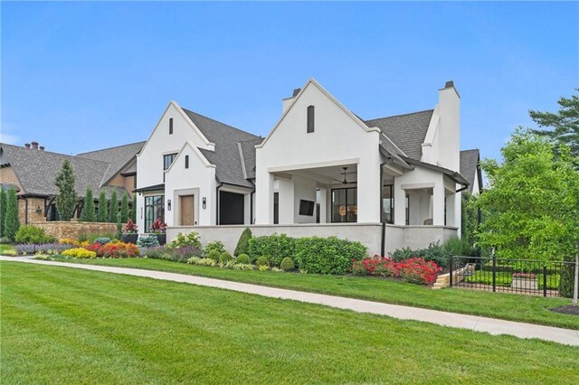 9358 Juniper Reserve Dr, Prairie Village, KS 66207 - view of front facade with a chimney, stucco siding, ceiling fan, and roof with shingles