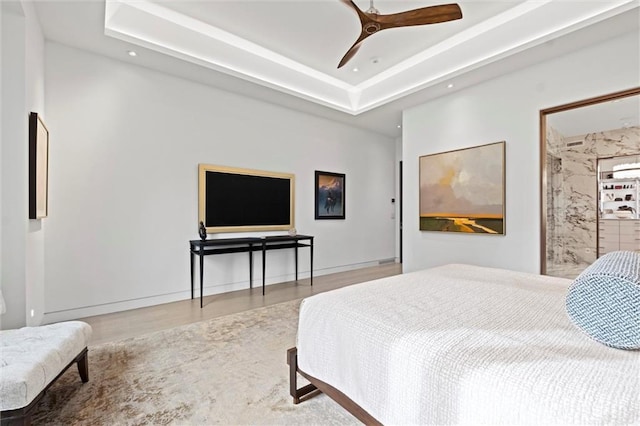 9358 Juniper Reserve Dr, Prairie Village, KS 66207 - bedroom featuring wood finished floors, a tray ceiling, recessed lighting, and a ceiling fan
