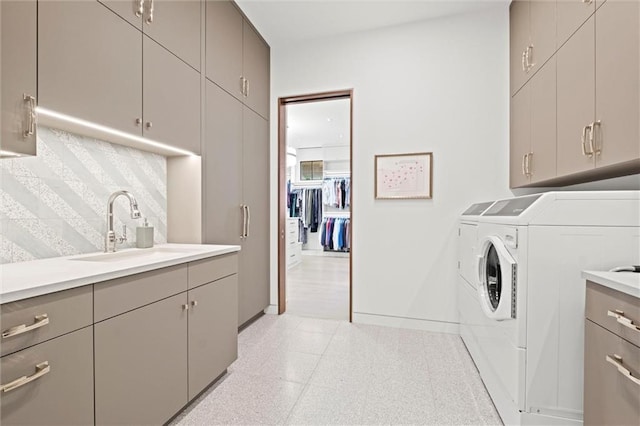 9358 Juniper Reserve Dr, Prairie Village, KS 66207 - washroom featuring washer and dryer, cabinet space, and light floors