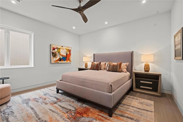 9358 Juniper Reserve Dr, Prairie Village, KS 66207 - bedroom with hardwood / wood-style floors, recessed lighting, and a ceiling fan