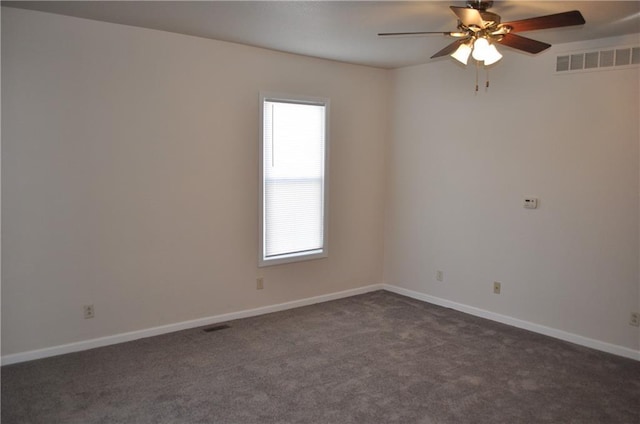 unfurnished room featuring dark colored carpet and ceiling fan