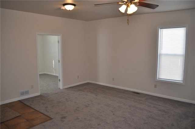 carpeted empty room with ceiling fan