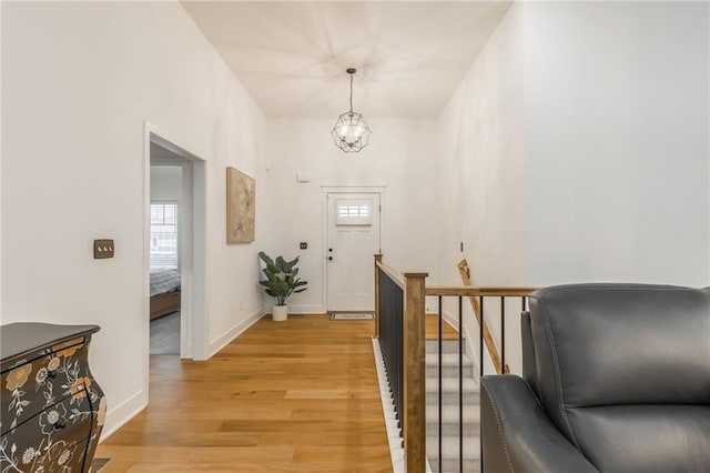 interior space featuring light hardwood / wood-style flooring and a chandelier