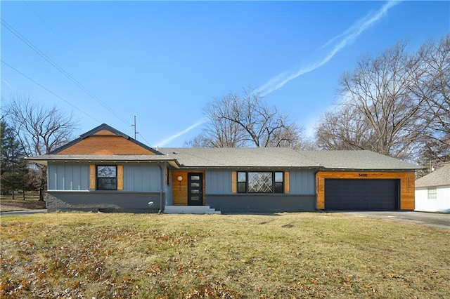 view of front of home featuring a garage and a front lawn